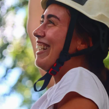 Traveler smiling during canopy adventure in La Fortuna Costa Rica with Arenal Volcano zipline tour